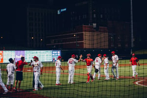 Professional baseball team congratulating themselves after a win