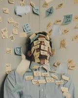 man covered with post-it notes of things do 