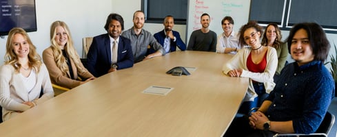 employees around a meeting table